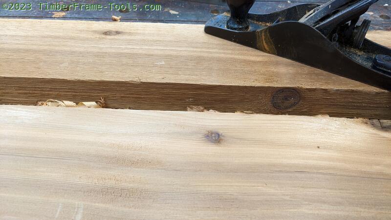 Planing rough sawn cedar.