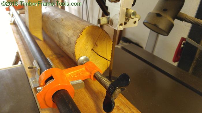 cutting one flat side on a log