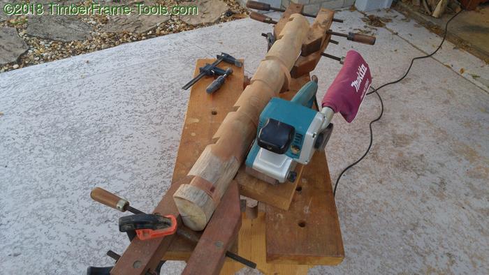 Sanding a log coat rack