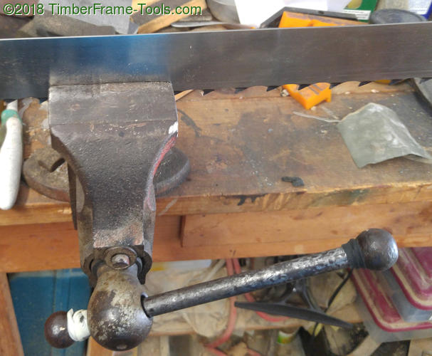 Reducing saw set with a vise.