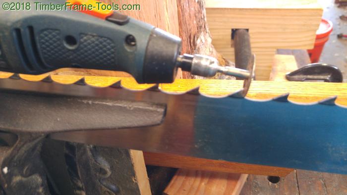 Sharpening a gang saw with a rotary tool.