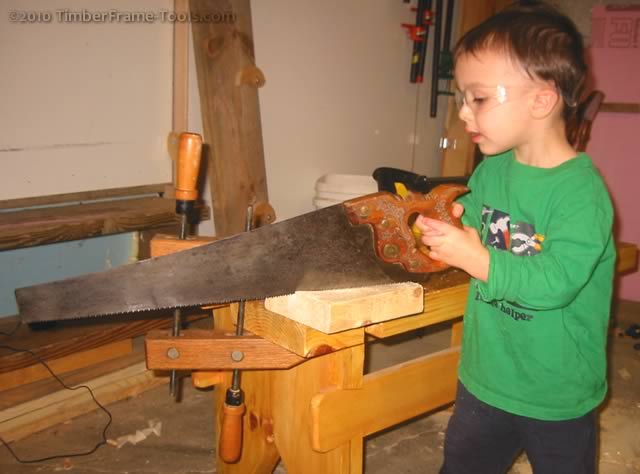 Boy with real saw